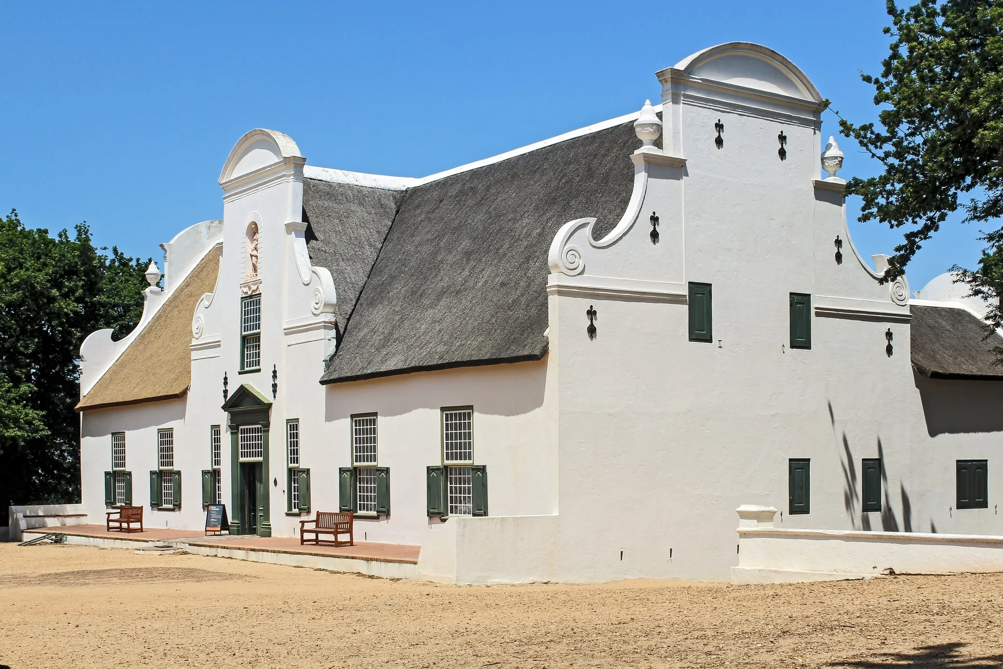 The main house of the Groot Constantia vineyard near Town . In 1685 Simon van der Stel , then governor of the Cape received a 763 hecare grant of land and built the main dwelling i
