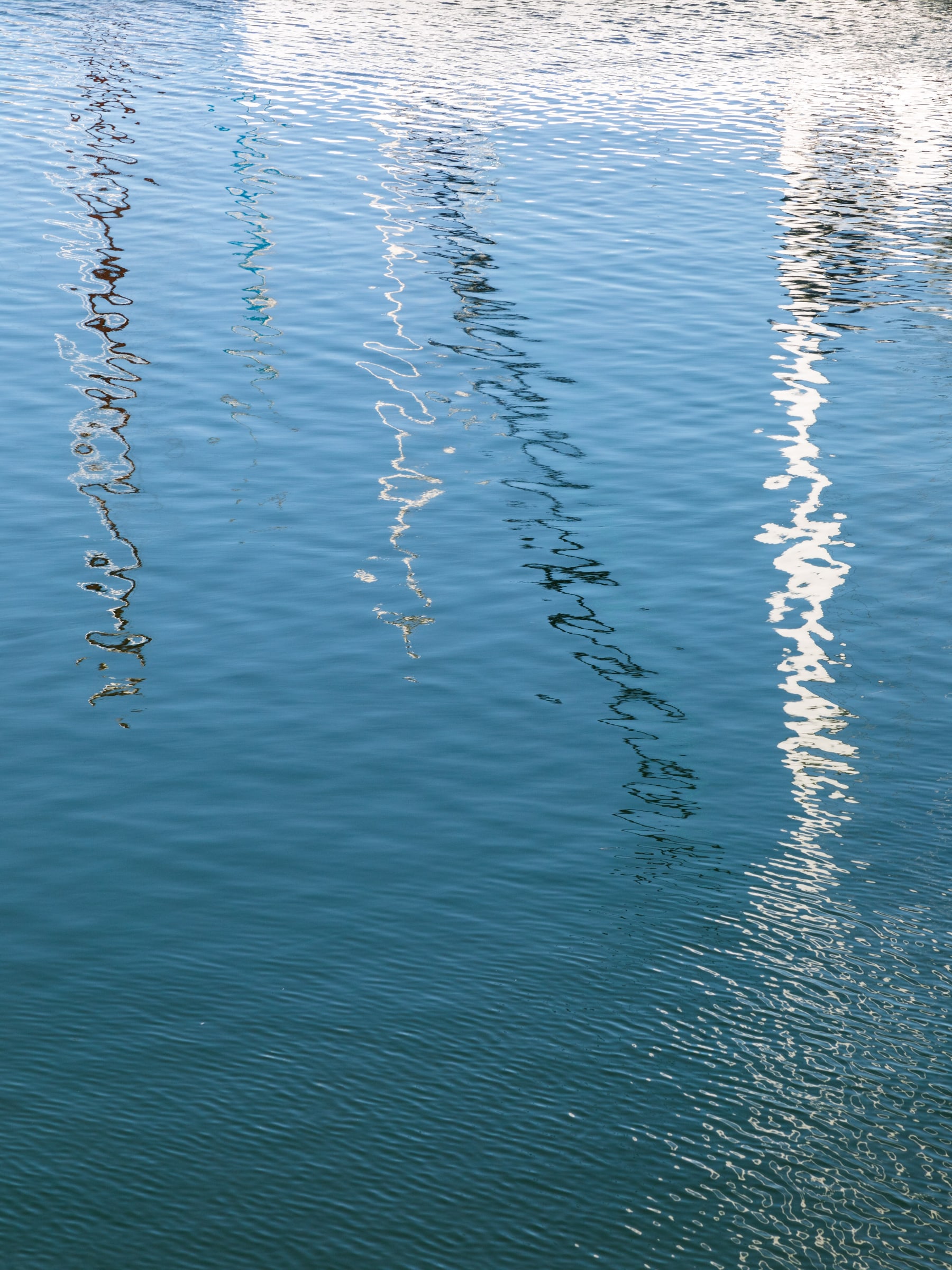 Reflections of sailboat masts in the marina, Knysna , Western Cape , South Africa