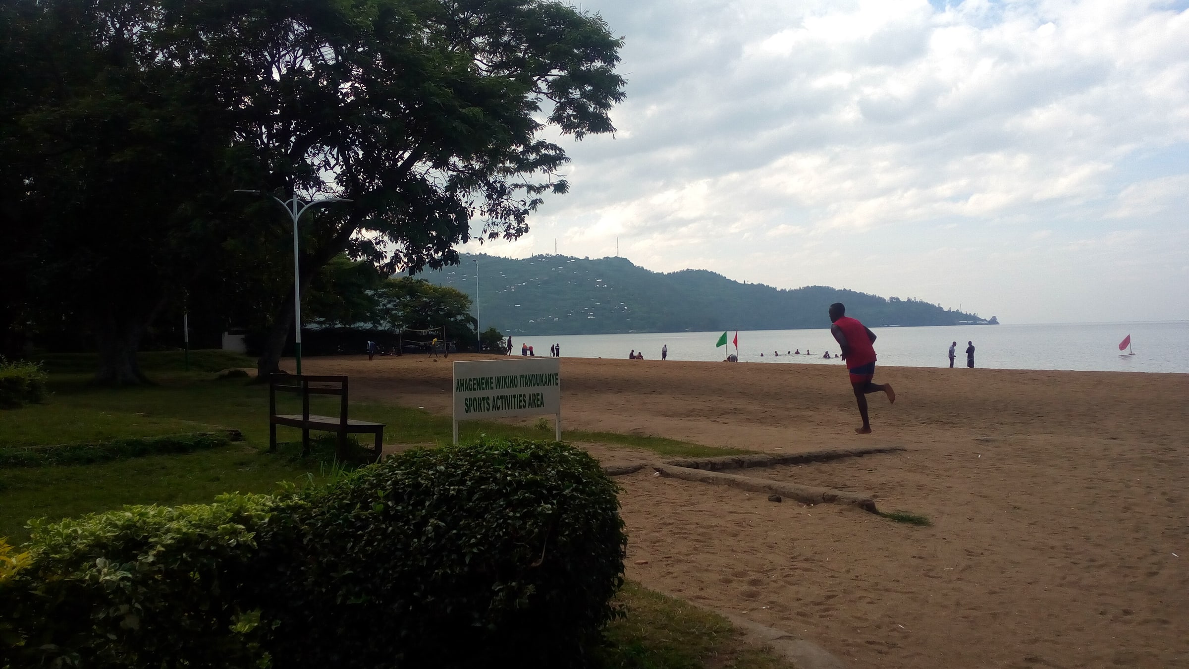 The youth congregate on the beach for recreational activities such as running or swimming or lounging and even beach volleyball