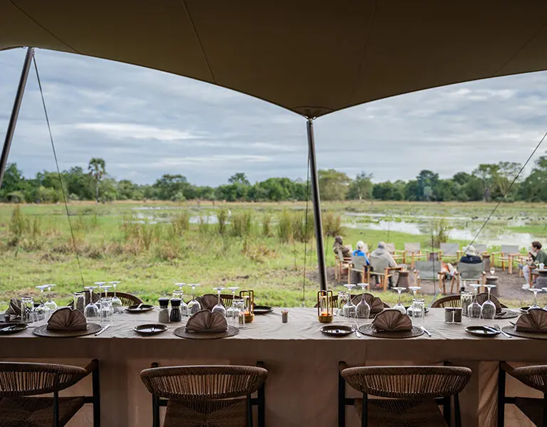 GORONGOSA SAFARIS Chicari Camp Main Area Dining table and pan views 19