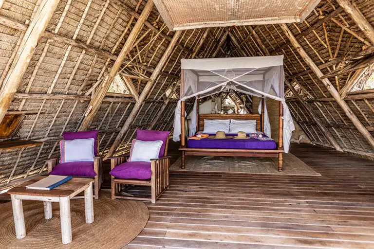 Tanzania Fanjove Island Banda bed seated area