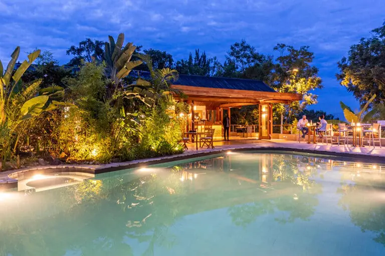 The Retreat Main Salt water pool lighting at night