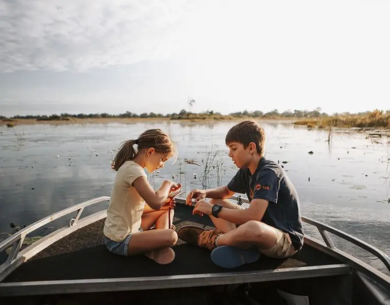 Vumbura Plains Botswana Wilderness Safaris boating family vumbura tcunniffe 010