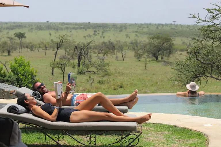 Naboisho Camp Guests relaxing at the pool