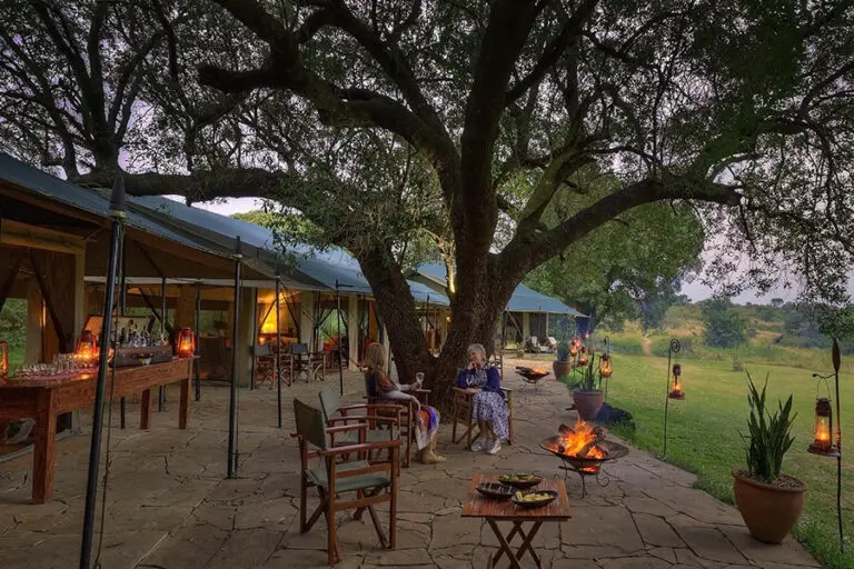 Kicheche Mara lounge exterior with guests 2
