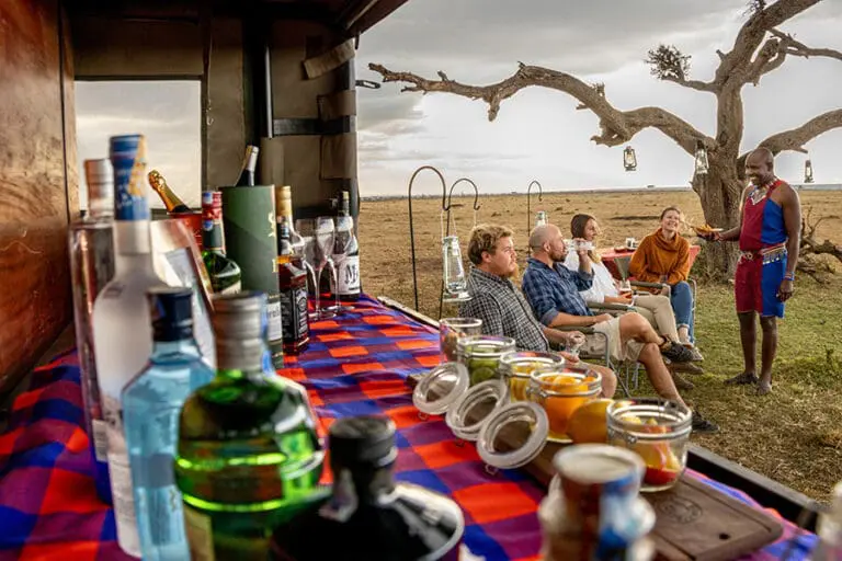 Naboisho Camp Guests enjoying bush bar setup