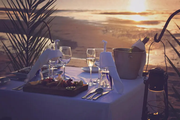 Azura Benguerra dining on beach