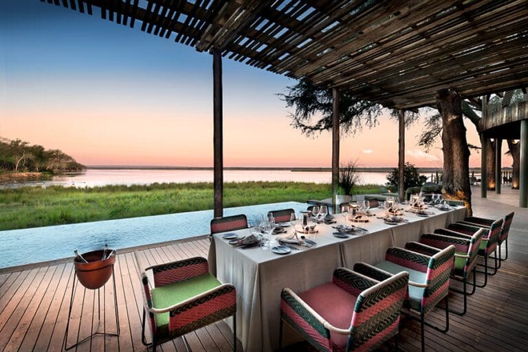 Dinner set beside the river at Lolebezi