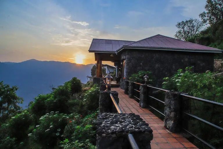 Nkuringo Bwindi Gorilla Lodge Sunrise over the forest suite
