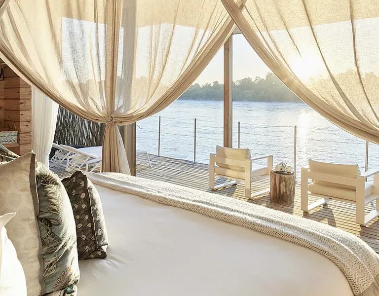 Victoria Falls River Lodge Island Treehouse Suites bed and view