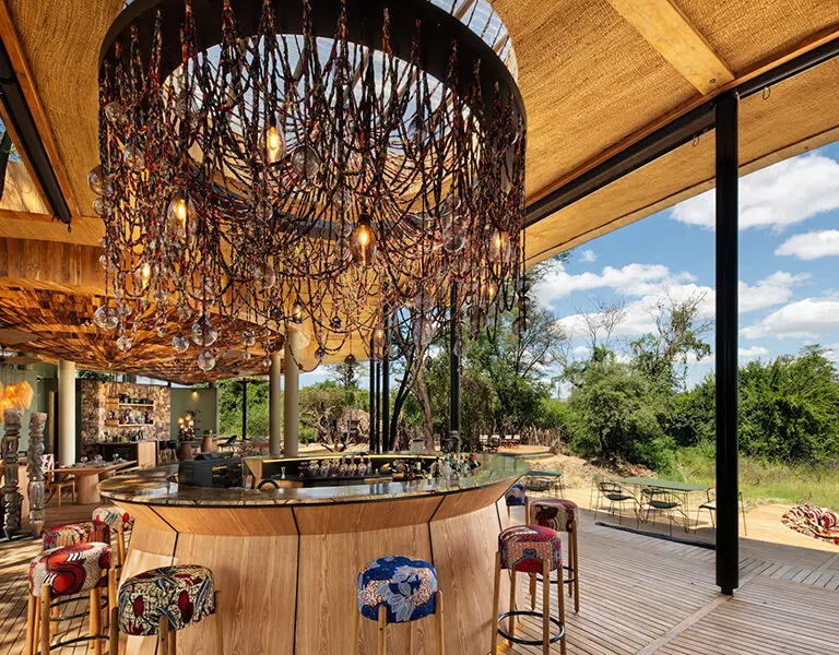 AndBeyond Grumeti Serengeti Tented Camp Guest Area bar with river view