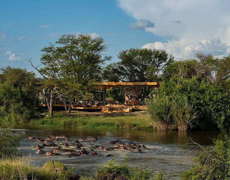AndBeyond Grumeti Serengeti Tented Camp Guest Area exterior with hippo pod 2