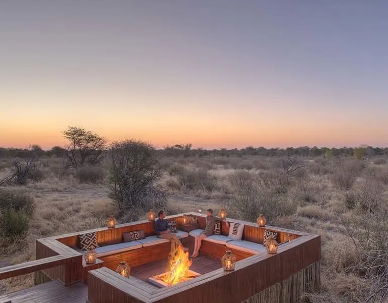 A fire deck looking over the Kalahari at dusk